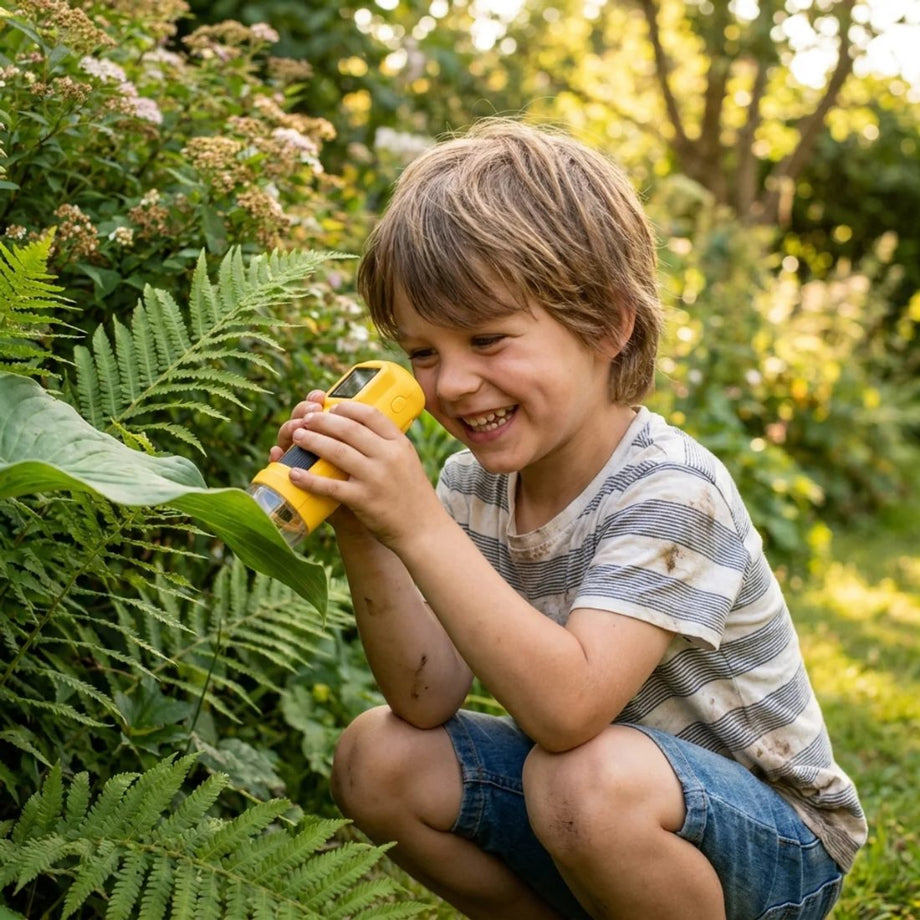 Child exploring with Trail Cubs microscope